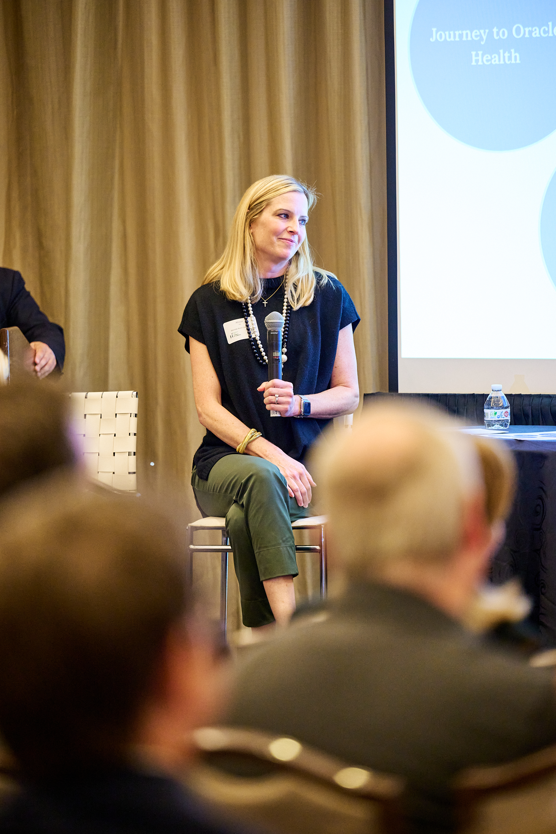 Global Health Innovators Summit Panel Discussion - Professional conference panel featuring healthcare experts with engaged audience members, showcasing collaborative healthcare innovation discussions